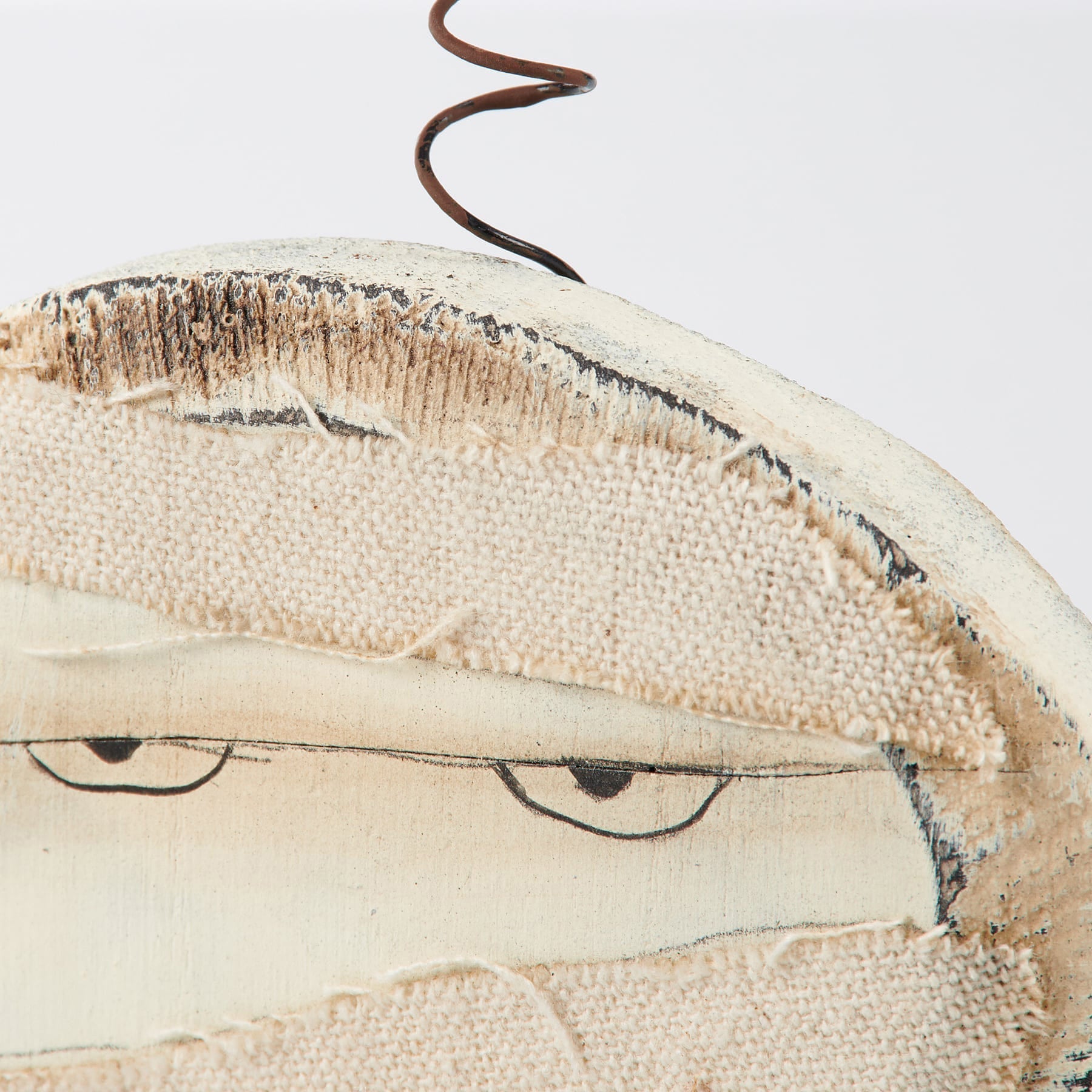 Rustic off-white fabric spooky ornament with stitched eyes and wire antenna from spooky ornament set