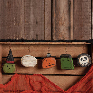 Five hand-painted wooden halloween spooky ornament set featuring witch mummy pumpkin frankenstein and skull designs