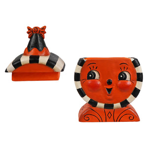 Orange ceramic jack o lantern laughing treat box planter with black and white stripes and a smiling face design