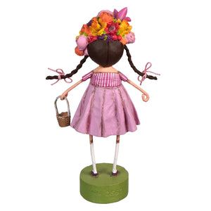A lori mitchell spring blossom figurine of a girl with dark braided pigtails wearing a pink striped dress and floral crown
