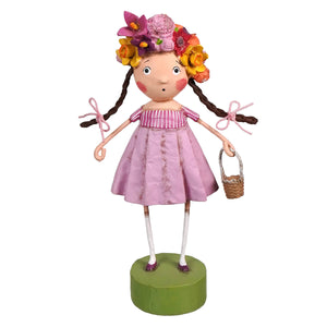 A whimsical lori mitchell pink paper-mâché doll with a floral crown and basket perfect for spring decor and ornaments spring blossom