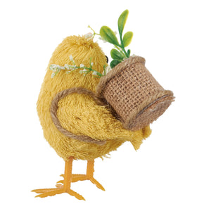 Yellow chick critter with textured straw feathers carrying a burlap pot with green leaves and white flowers spring chicks set