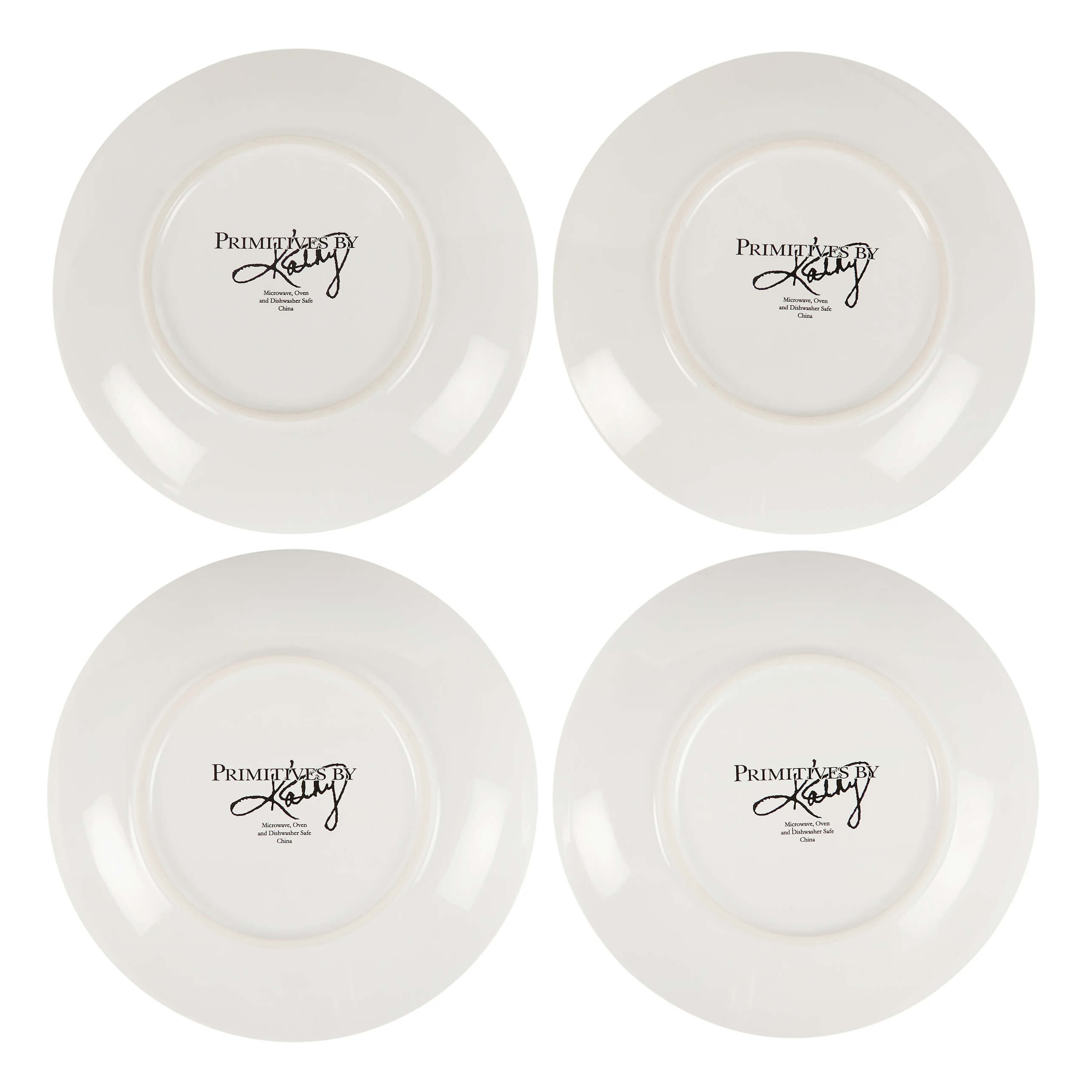 White ceramic spring plate set with glossy finish showing primitives by kathy logo on the back of each saucer
