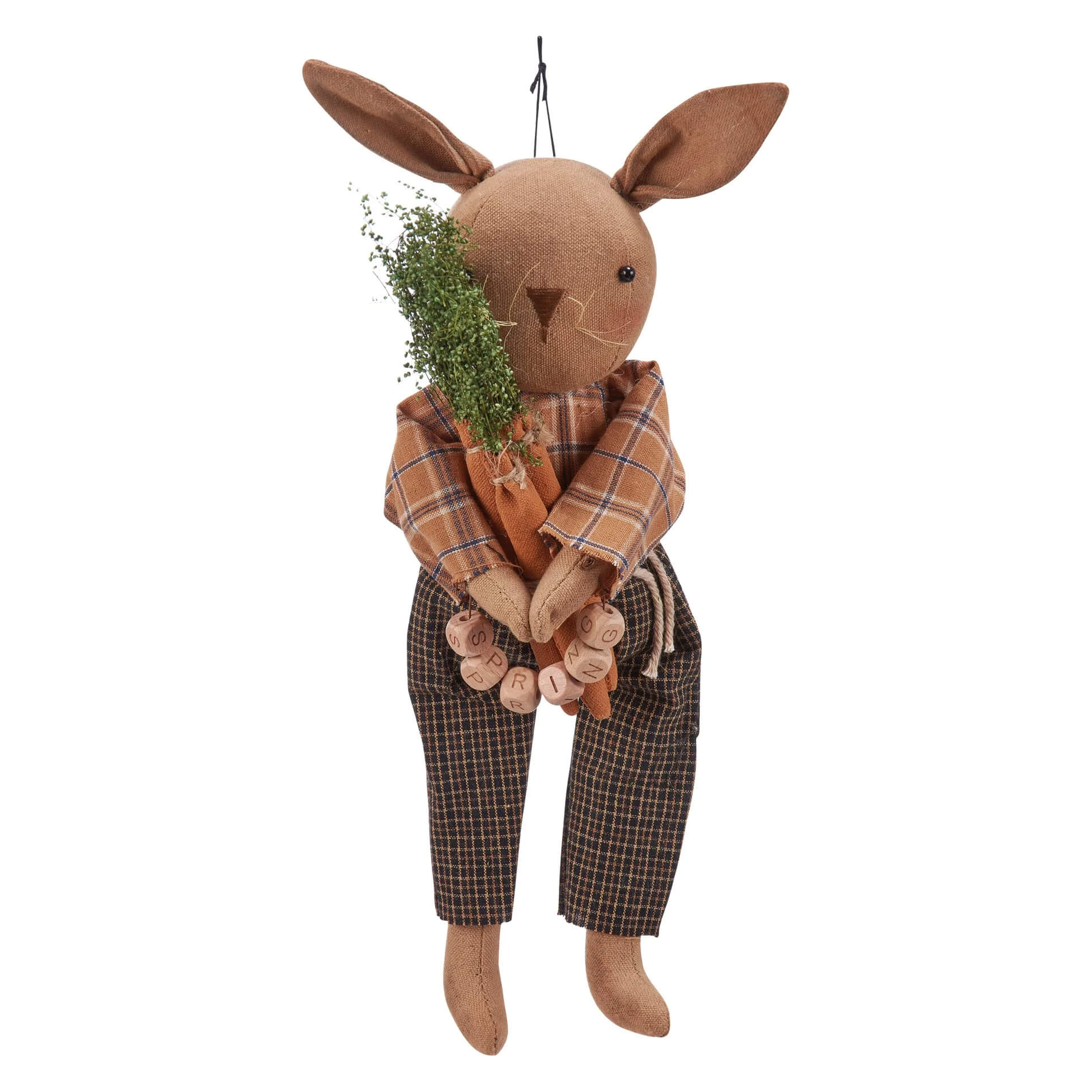 Brown fabric spring rabbit doll dressed in plaid shirt and pants holding dried greenery bundle