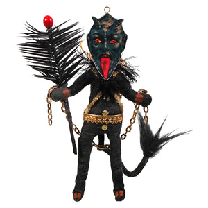 Black krampus freestand ornament featuring spun cotton black devil with red glowing eyes, long tongue, and gold chains