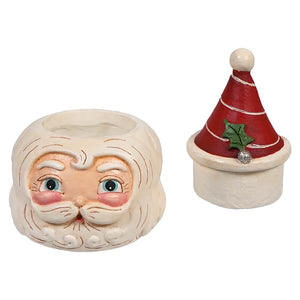 Ceramic Santa Claus face and red hat Christmas decorations.