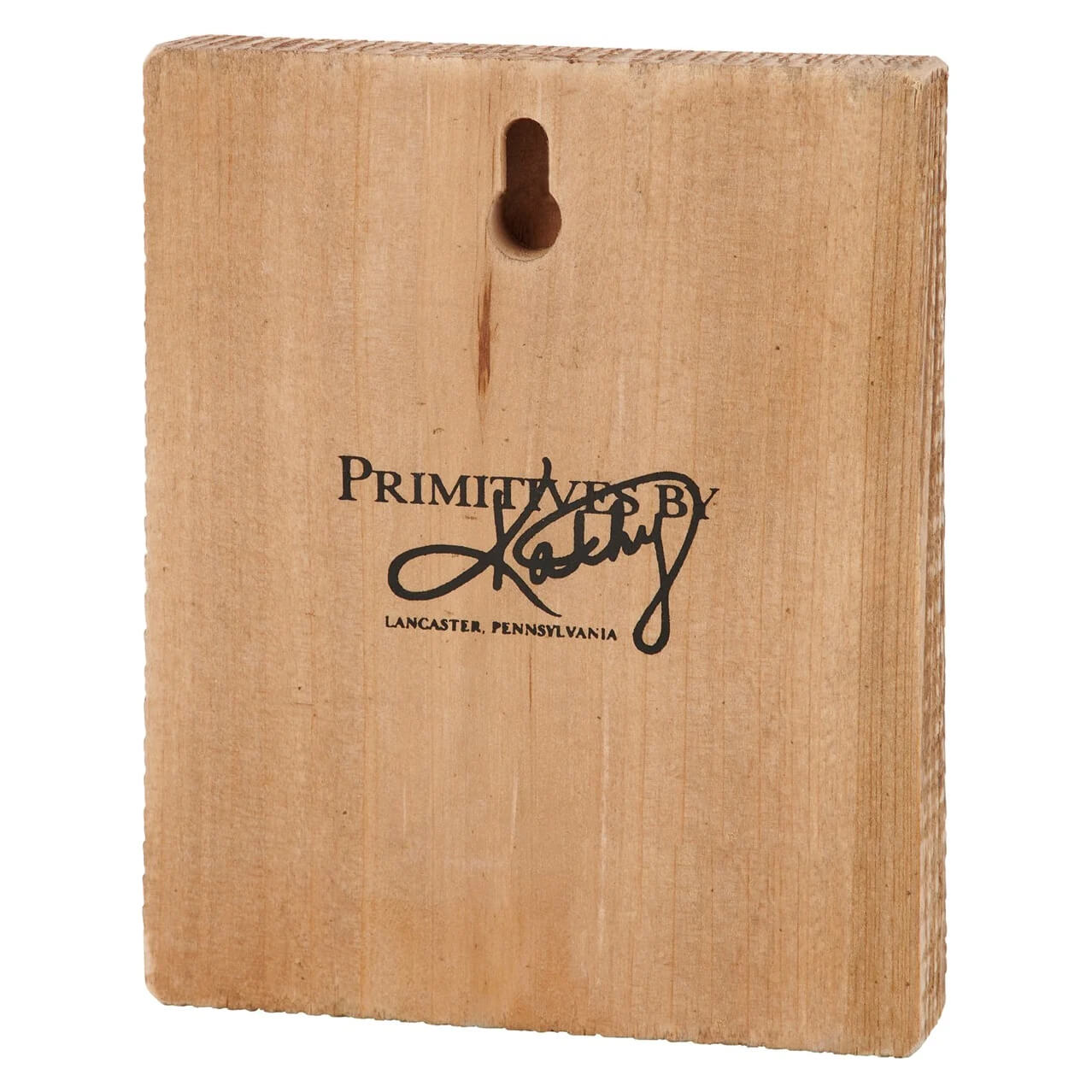 Wooden block with ’Primitives by Kathy’ branding from Lancaster, Pennsylvania.