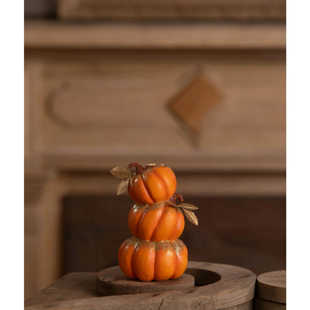 Stack of pumpkins candle holder with hand-painted resin orange pumpkins gold glitter and metallic leaves by bethany lowe