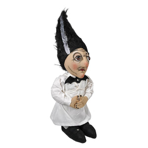 A whimsical black and white standing gnome figurine with a tall spiky hat and expressive face named carmella stein