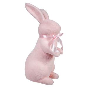 Pink ceramic bunny wearing a light pink ribbon bow around its neck.