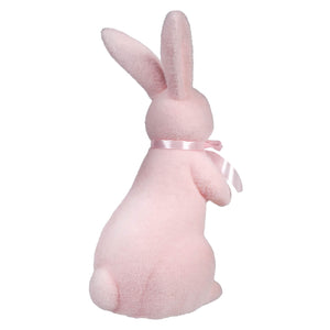 Pink plush bunny with a satin ribbon around its neck.
