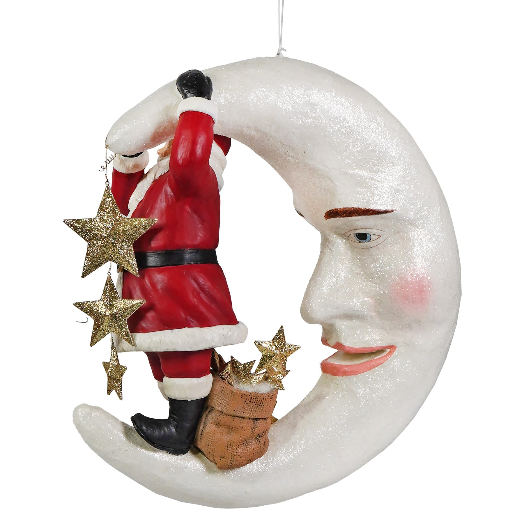 A whimsical white glittery crescent moon ornament with a smiling face featuring santa claus climbing with golden stars from bethany lowe designs santa figures and folk art santas