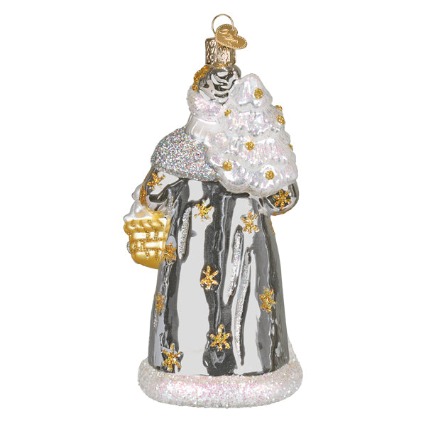 Silver and gold glittery glass christmas glass ornament of santa holding a decorated tree workshop santa ornament