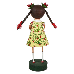 A lori mitchell whimsical strawberry fields figurine of a girl in a yellow strawberry dress with braided pigtails