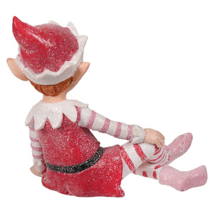 A glittery red and white sugar coated sweet resin elf figurine with striped sleeves perfect for christmas tabletop decor