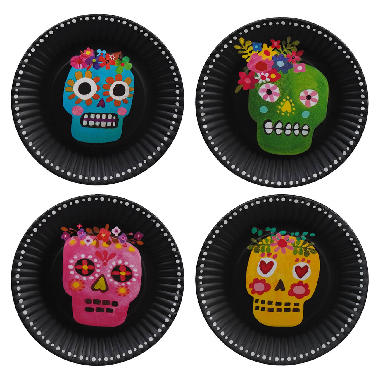 Four colorful sugar skulls decorated with floral patterns on black circular plates.