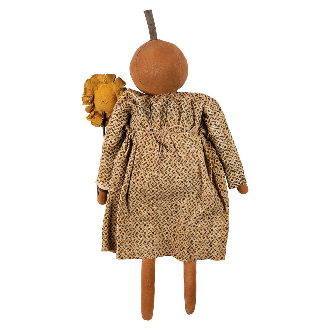 A rustic handcrafted hattie pumpkin doll with a round brown head dressed in a beige patterned dress perfect for halloween dolls