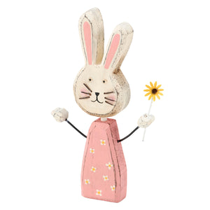 A charming wooden sunny bunny chunky sitter with pink floral dress and yellow daisy small bunny figurine