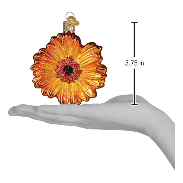 Sunset gerbera daisy ornament in vibrant orange and yellow glass with dark red center and gold-toned hanging loop perfect for flower and garden ornaments