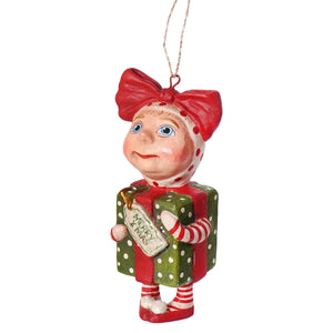 A charming surprise package girl ornament by bethany lowe designs featuring a red and white polka-dotted elf holding a green gift box by debra schoch