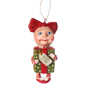 A charming bethany lowe designs surprise package girl ornament in red and green holding a polka-dotted gift by debra schoch