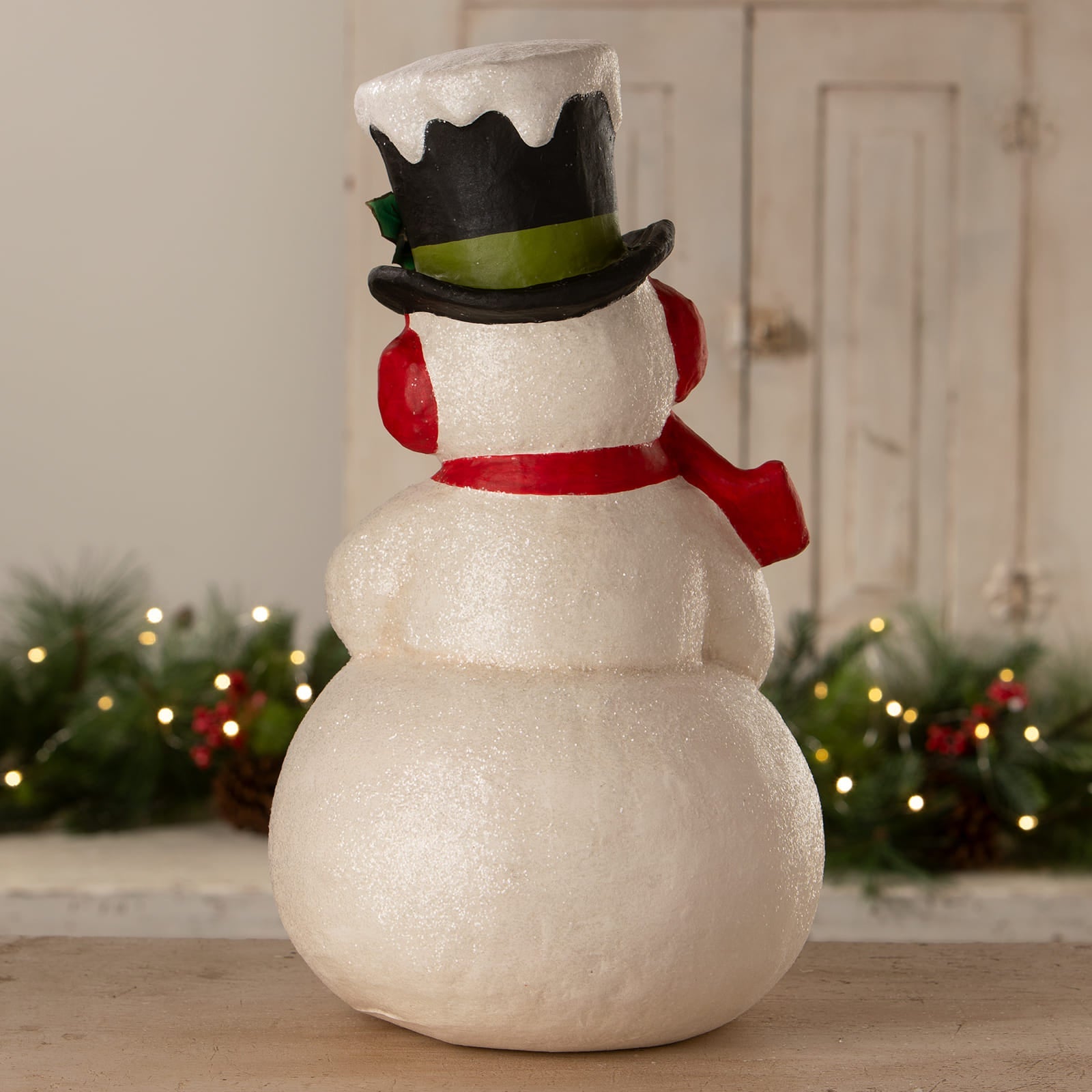 Surprised snowman white glittery figurine with black top hat green band red earmuffs red scarf bethany lowe design christmas snowman figures decor