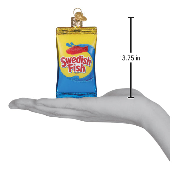 A translucent blue and yellow swedish fish dessert and confectionery ornament with a gold-colored cap for hanging