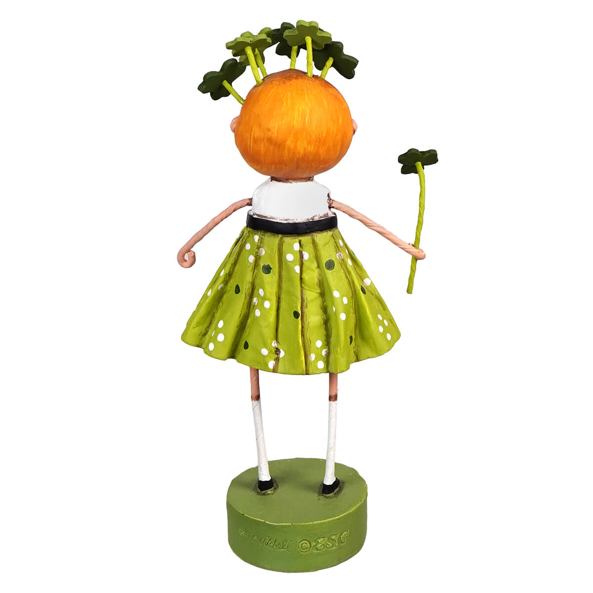 Whimsical lori mitchell sweet clover figurine with carrot head wearing green polka dot skirt holding shamrock for st patricks day