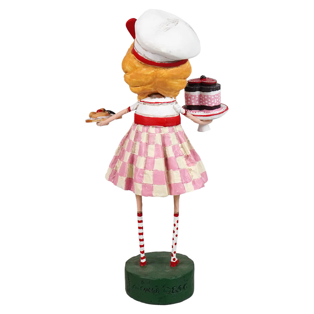 A lori mitchell figurine of a blonde waitress in a pink and white checkered skirt holding a tray with valentine treats cake