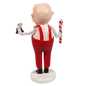 A glossy red and white sweet santa figurine in suspenders holding candy canes from bethany lowe designs santa figures
