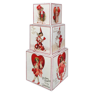 Stacked white cardboard sweetheart blocks set featuring vintage ellen clapsaddle cupid designs by bethany lowe designs