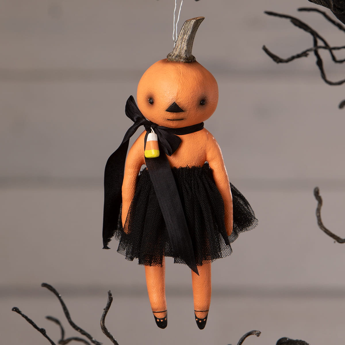 Orange pumpkin ornament doll with black tulle skirt and candy corn pendant perfect for halloween pumpkins and gourds decor