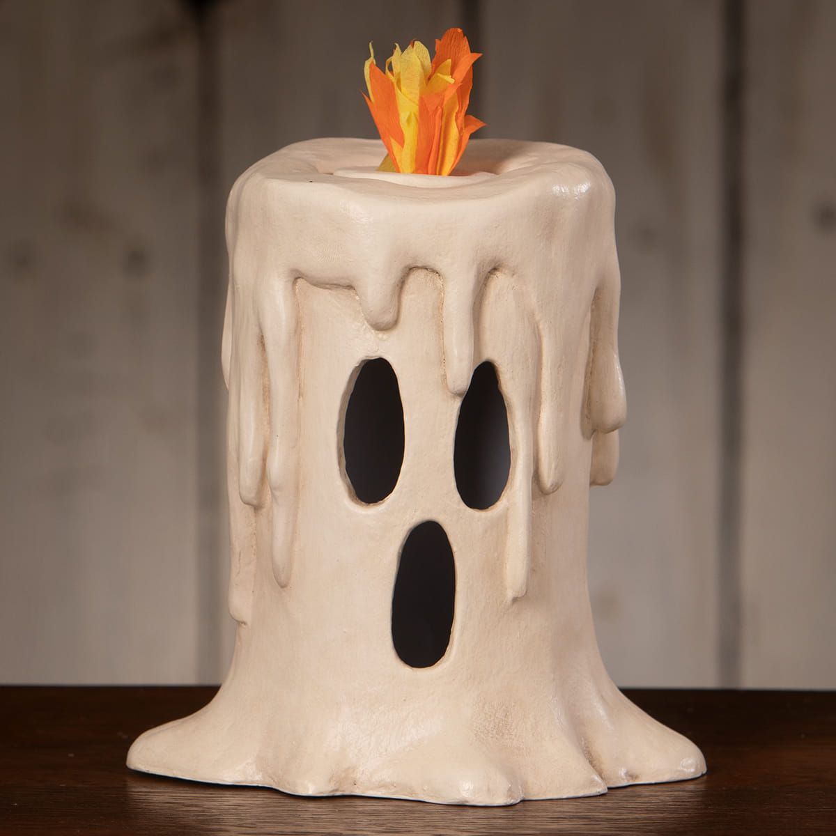 Cream-colored ghost-shaped tall flam’in candle luminary with faux orange and yellow flame bethany lowe halloween lanterns