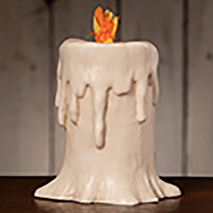 A white ceramic tall flam’in candle luminary with a melting wax effect and orange flame, perfect for bethany lowe halloween lanterns