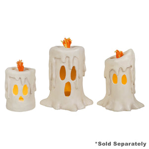 Set of three white ghost-shaped led candles with orange flames and glowing faces bethany lowe halloween lanterns candle luminary