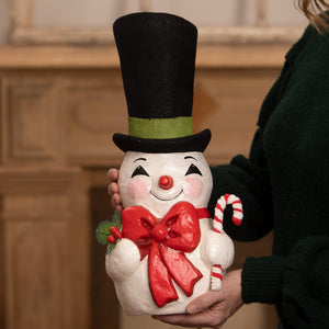 A cheerful white tall hat jolly snowman figurine with black top hat red bow tie and candy cane from bethany lowe designs christmas snowman figures and decor