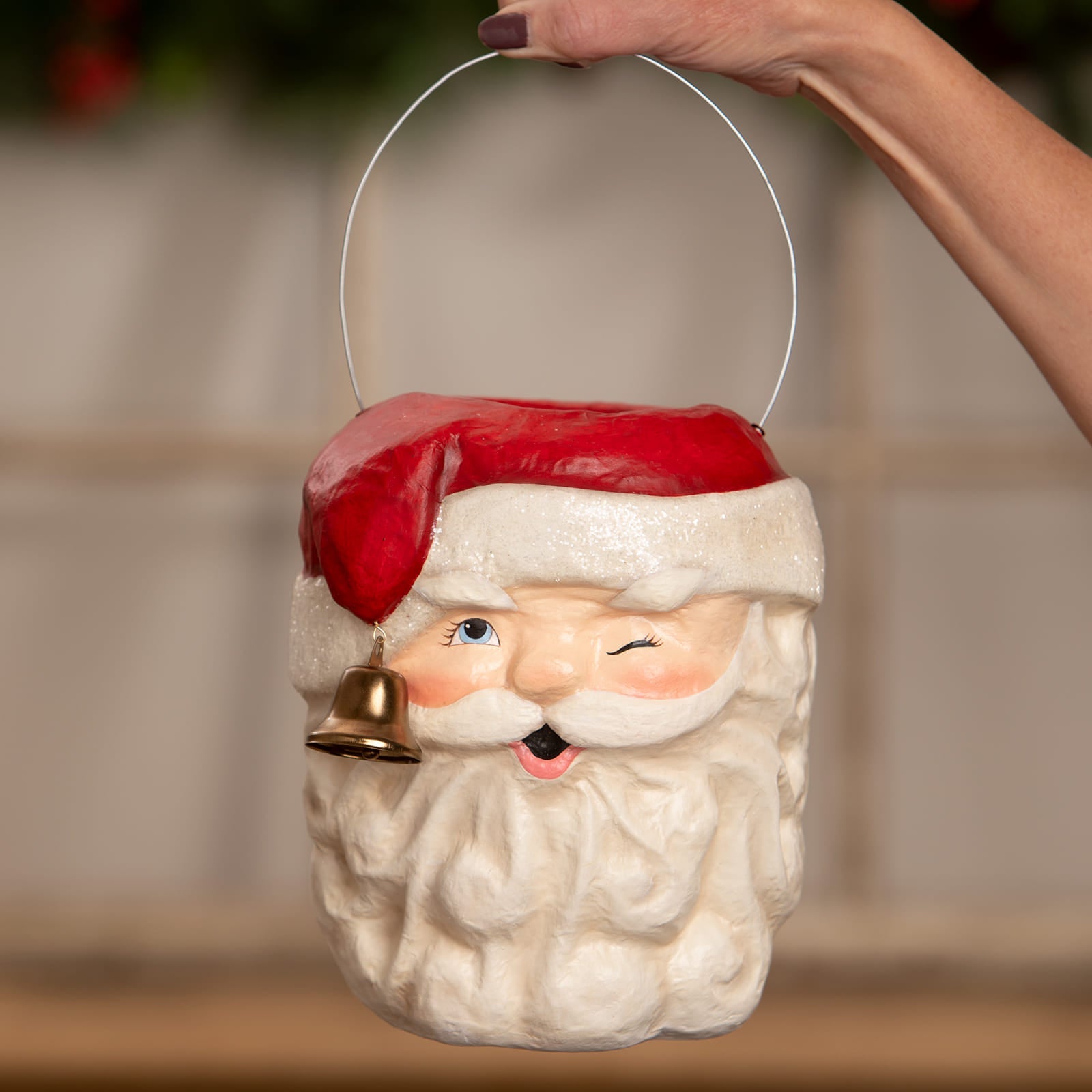 A charming red and white bethany lowe design tall santa bucket with a gold bell hanging from his beard christmas buckets and lanterns