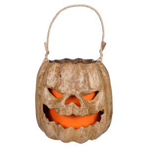 Tan scary face pumpkin bucket with raggedy junction design handcrafted folk art and glowing orange light inside