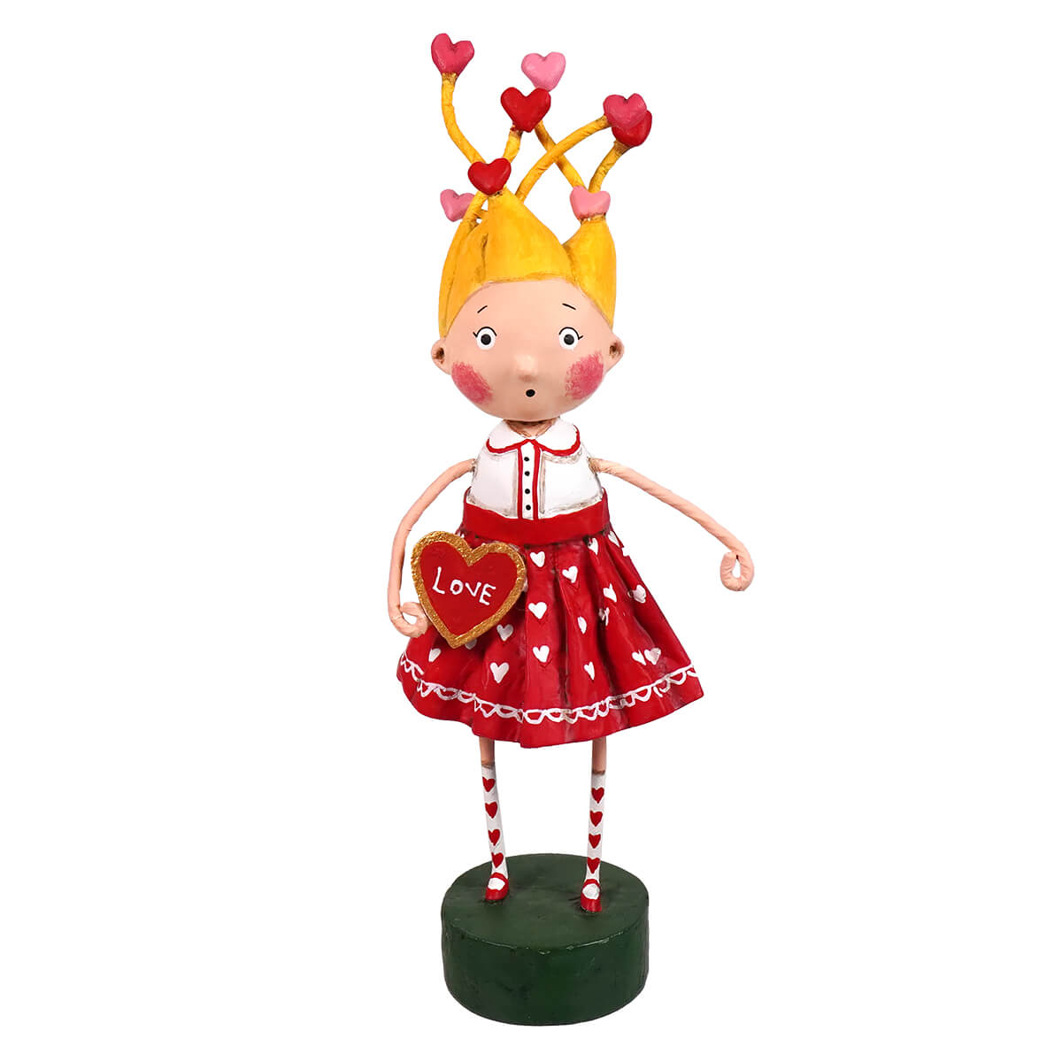 A lori mitchell folk art figurine of a blonde girl in a red heart dress holding a golden love heart spreading holiday cheer