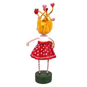 A lori mitchell folk art figurine called tangled in love with yellow pigtails red heart skirt spreading holiday cheer