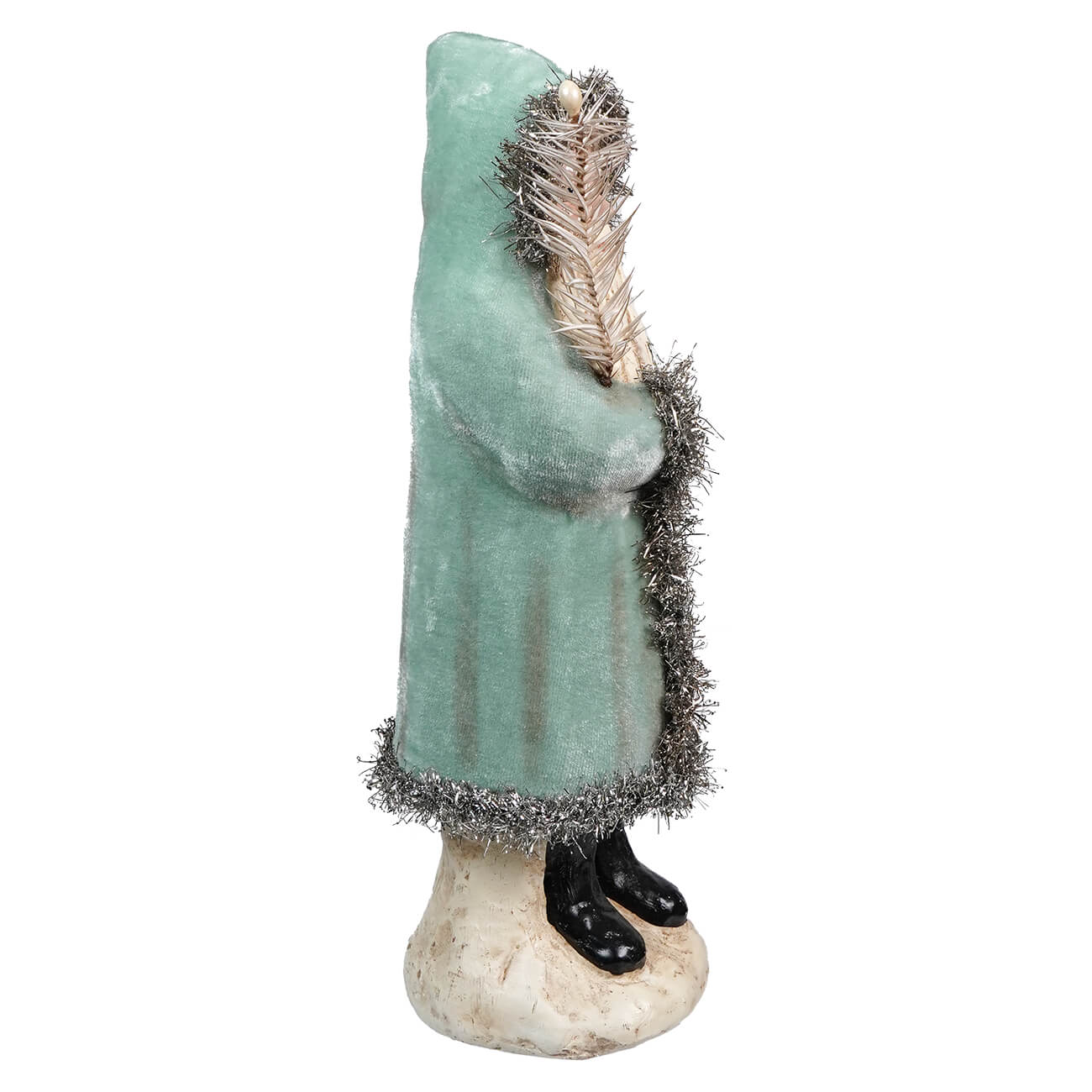 Mint green figurine of a person wearing a coat with feather and fur trim, standing on a base.