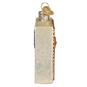 Vintage-style glass texas postcard ornament shaped like a cream-colored radio with gold accents and glitter texture