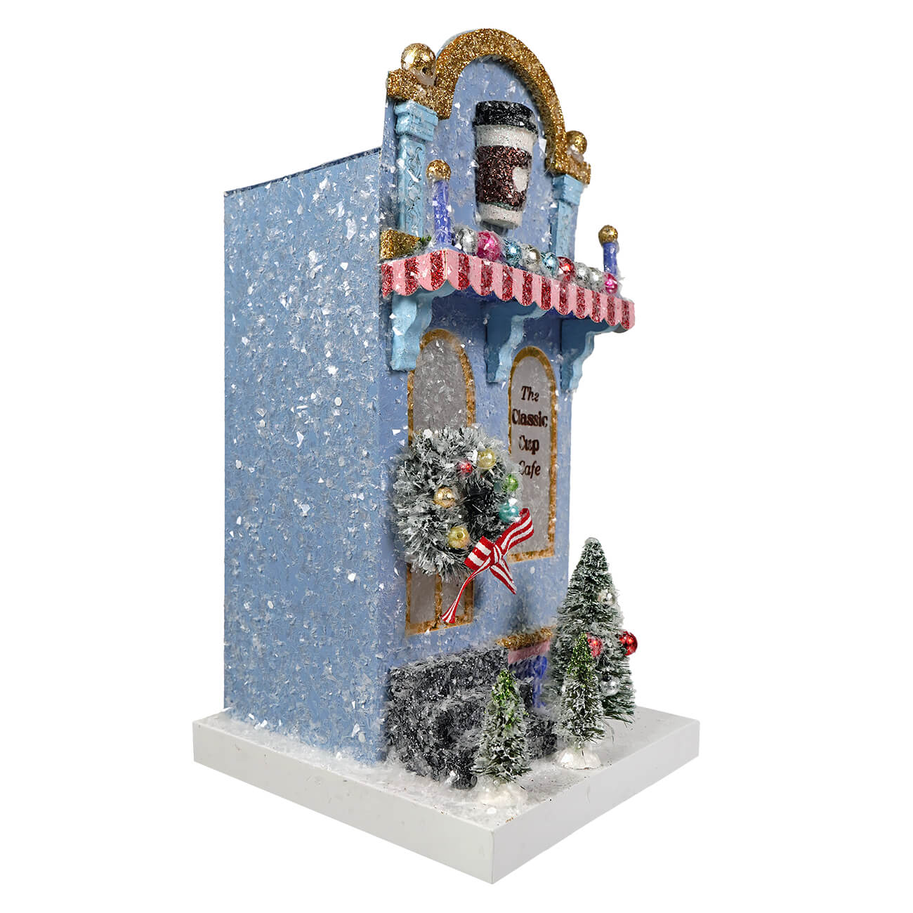 A festive blue classic cup cafe figurine by cody foster with glittery snowflakes gold trim wreath and light cord ready