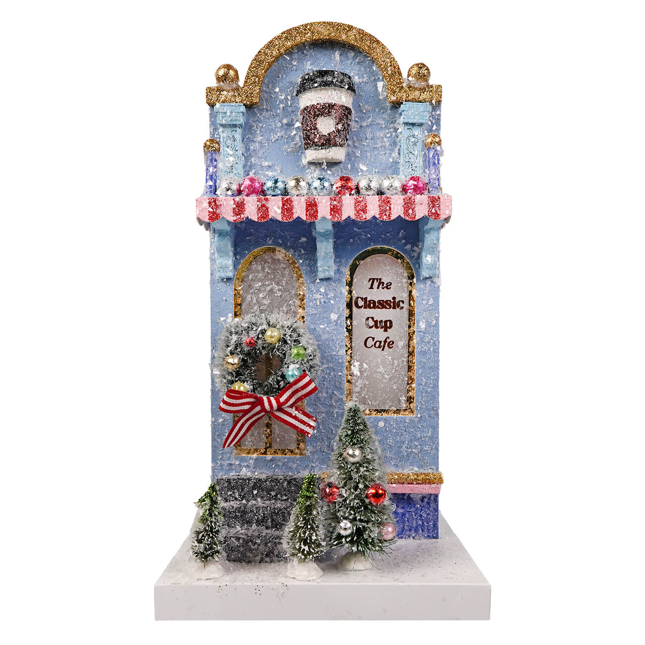 A festive blue and gold classic cup cafe miniature by cody foster with glittery snow and a red white striped awning
