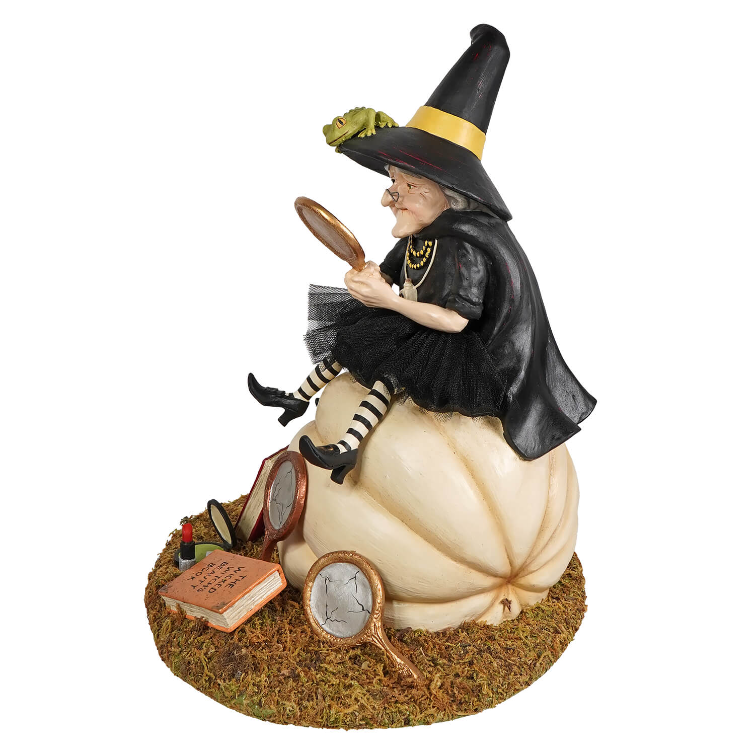 A whimsical figure of the fairest witch seated on a cream pumpkin holding a mirror from bethany lowe designs figural decor