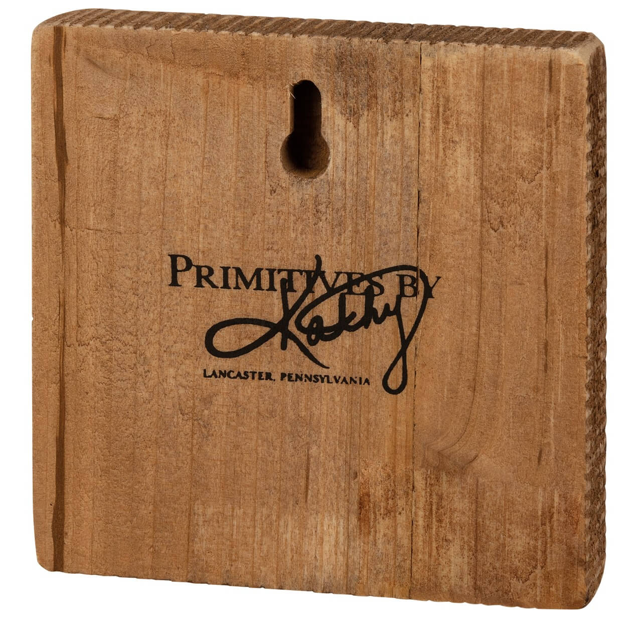 Wooden block with ’Primitives by Kathy’ branding from Lancaster, Pennsylvania.