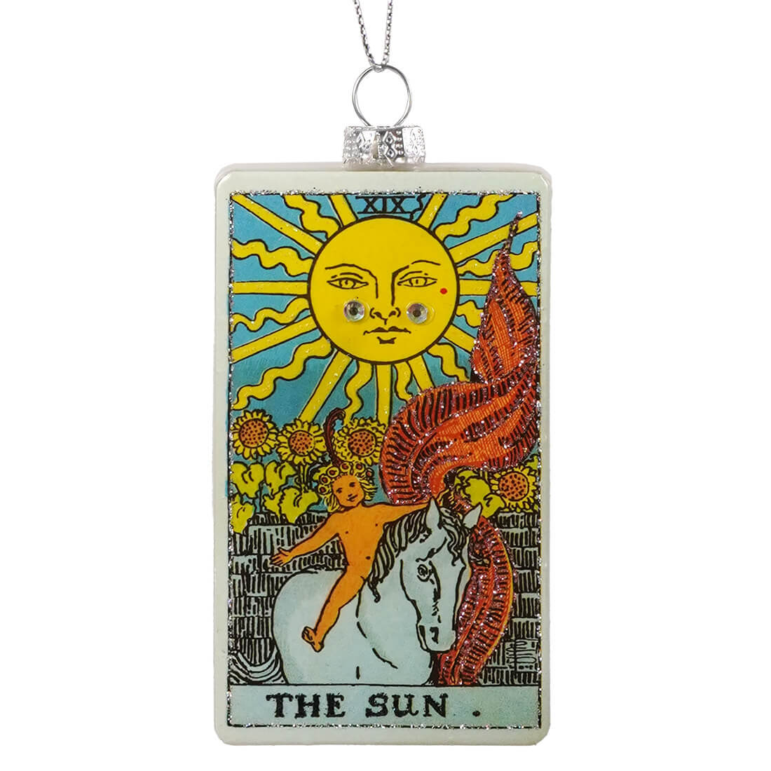 A rectangular cody foster glass ornament featuring the sun tarot card with a glittery orange and red mane and sunflowers