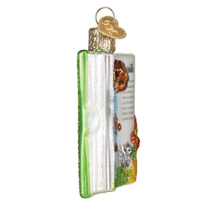 A green and white glass figural decor ornament with a gold heart tag perfect for world christmas tree toppers