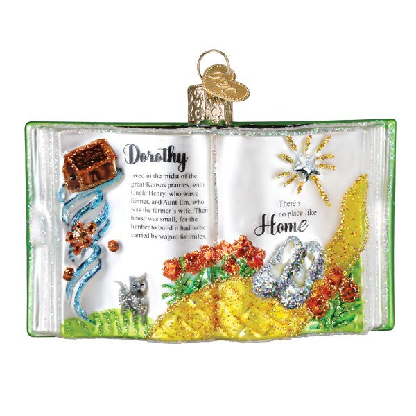 Glass ornament open book with wizard of oz scenes featuring dorothy’s ruby slippers and yellow brick road for world christmas figural decor