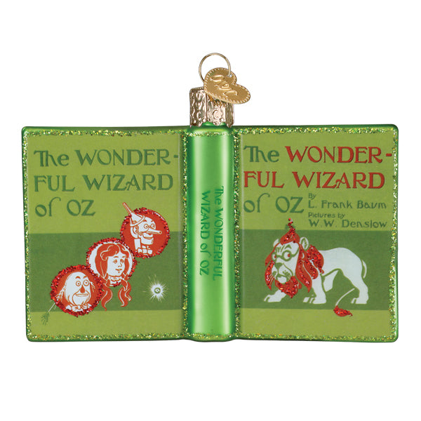 Green glass figural decor shaped like an open book with wizard of oz characters for world christmas tree toppers